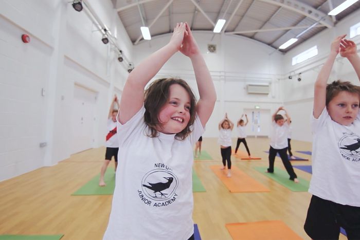 Happy pupils in a yoga class